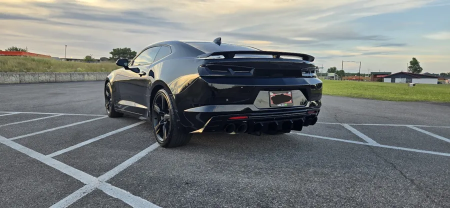 Black Chevrolet Camaro rear quarter with a deep gloss finish after detailing