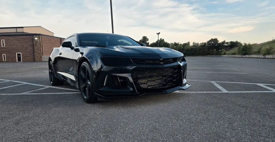 Black Chevrolet Camaro front end polished to a mirror shine