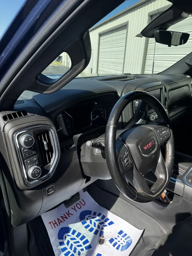 Detailed GMC truck cockpit with the dash, wheel and console cleaned